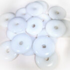 A group of white beads sitting on top of a table.